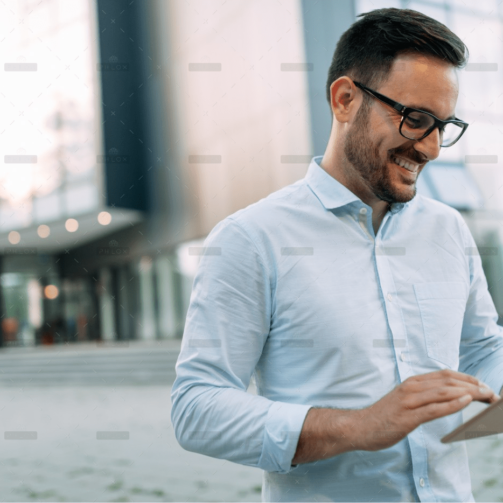 demo-attachment-59-portrait-of-businessman-in-glasses-holding-tablet-AWVHCJU